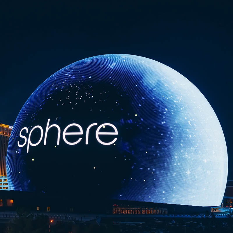 Exterior view of The Sphere at The Venetian Resort, Las Vegas, glowing with animated LED lights against the night sky, highlighting one of the top 5 must-see attractions in Las Vegas for 2025.